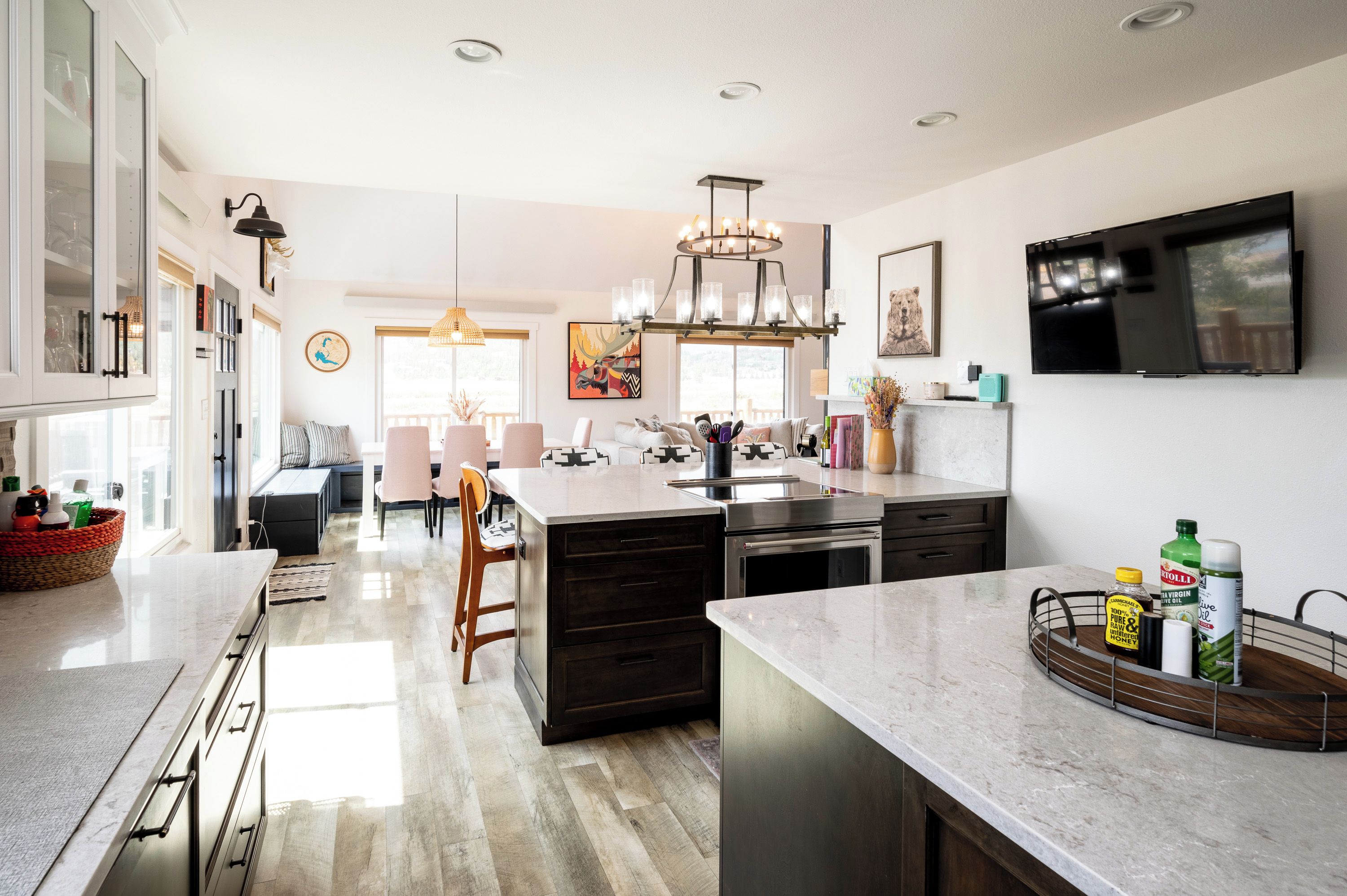 Bright open kitchen with island seating, dining nook, and modern finishes