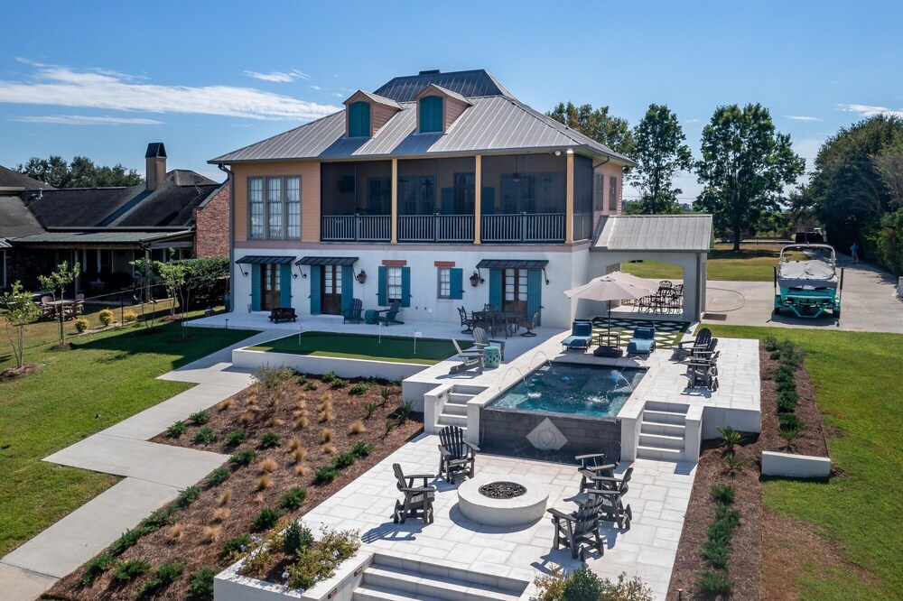 Large Beautiful Home On False River w/ Pickleball Court and Heated Cocktail Pool