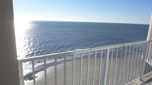 A balcony with a view of the ocean.