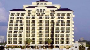 A multi-story hotel with a symmetrical facade, large windows, and a central entrance. - Direct Oceanfront 1,200sf 1BR/2Bth Condo; Full 4star Hotel Service; Walk to All! (Fort Lauderdale)