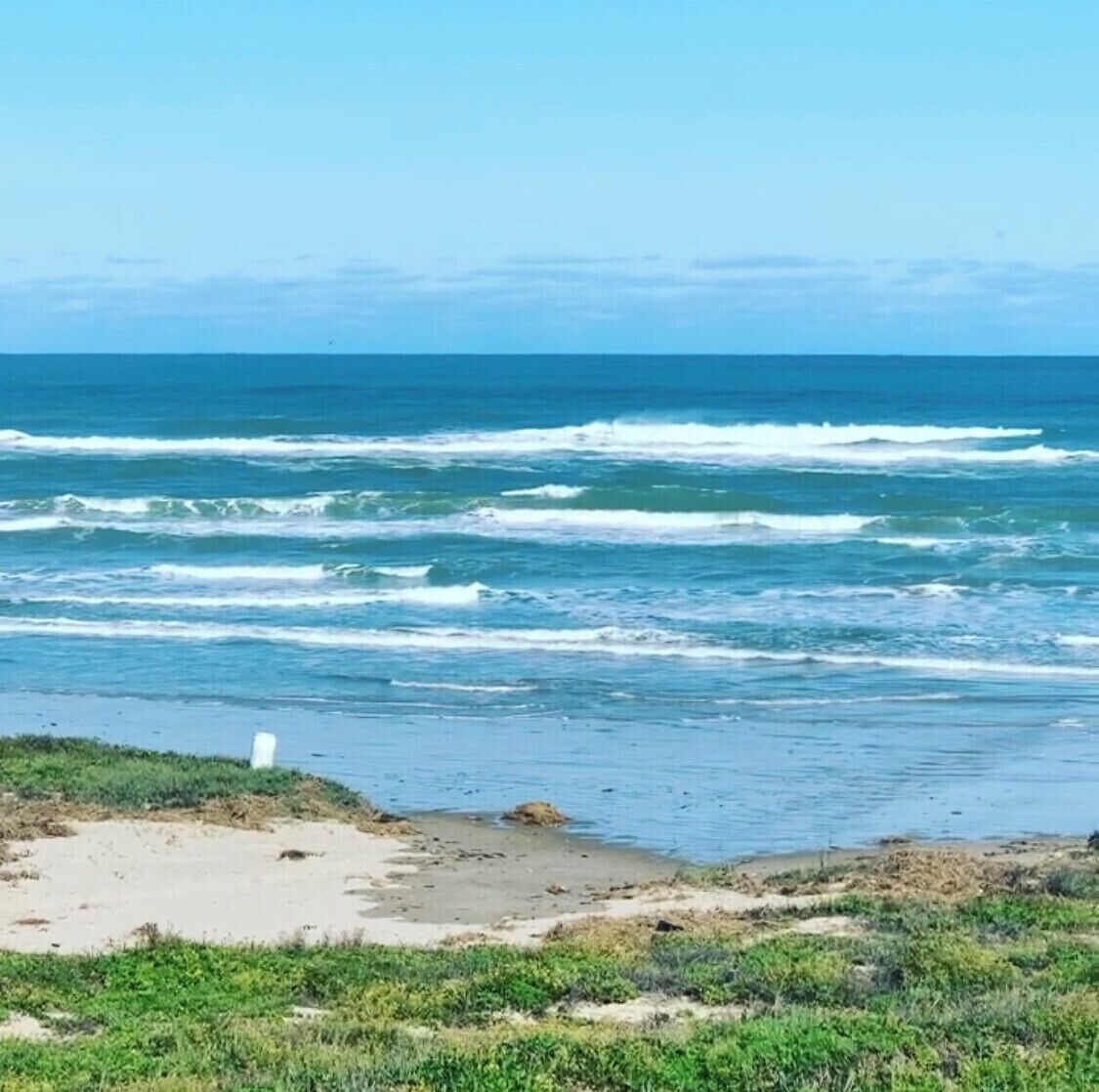 On the beach, sun-loungers