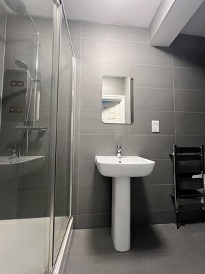 Shower, hair dryer, towels, soap