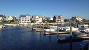 A marina with docked boats and waterfront houses.