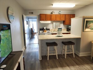 Enjoy cooking in this well-equipped kitchen with a central island and ample seating.