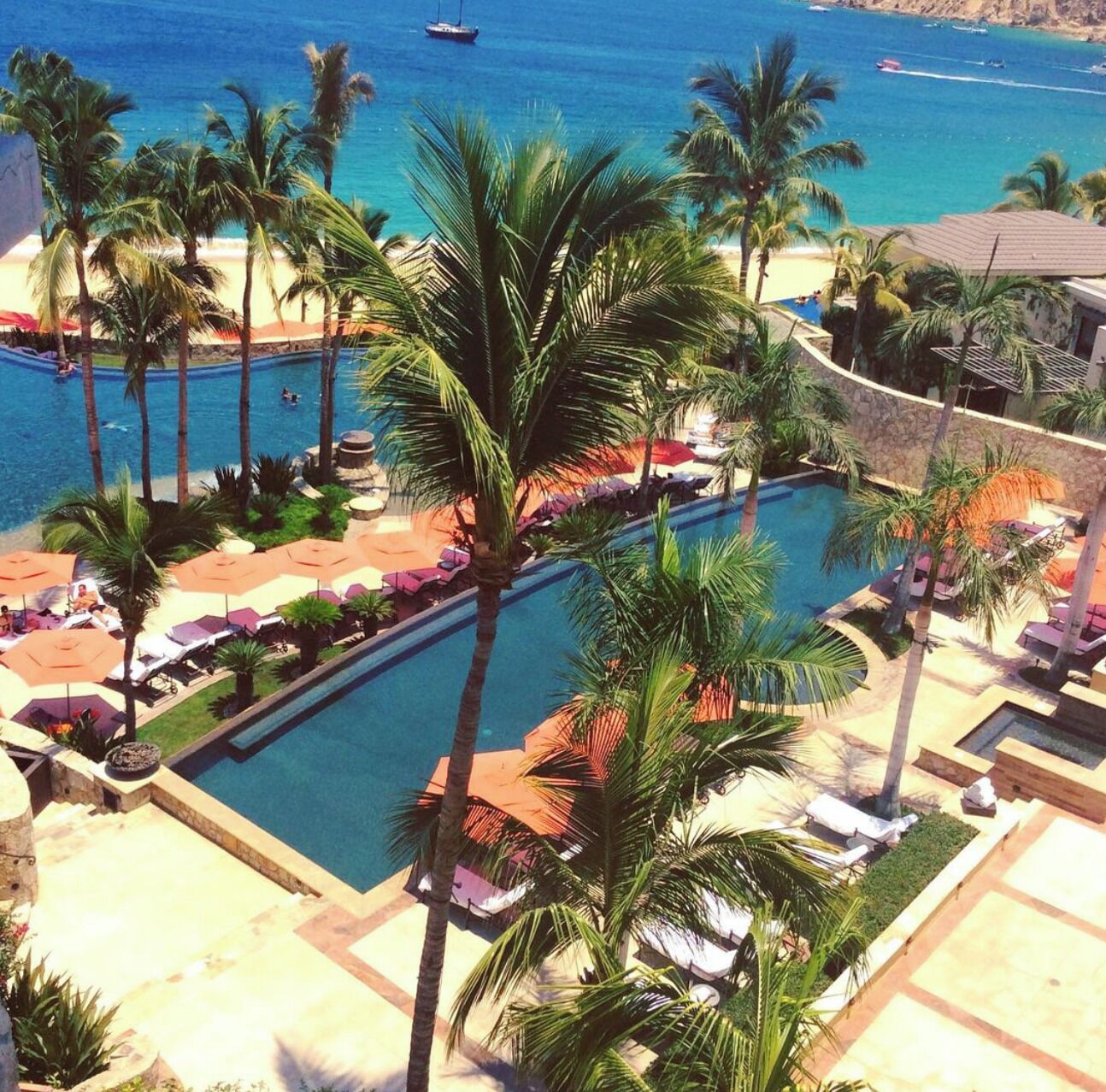 Just above the main pool is a lap pool and an elevated patio overlooking the sea