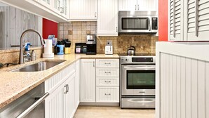 Coffee/tea maker, fridge, microwave, oven