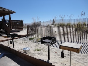 Enjoy a beachside barbecue with a grill and outdoor seating.