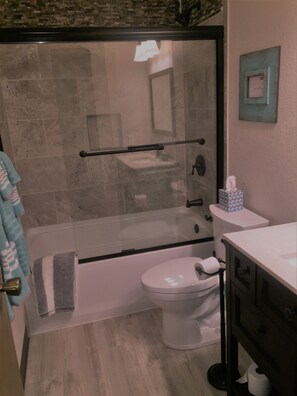 Combined shower/bathtub, hair dryer, towels, soap
