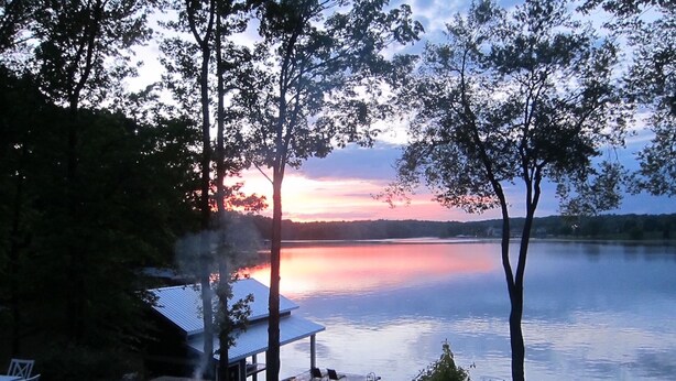 A lakeside patio with outdoor seating and a barbecue area. - Large Family Lakehouse w/ Dock, Deck, Patio, Views (Semora)