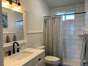Shower, hair dryer, towels, soap