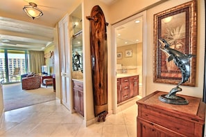 Relax in our spacious lobby with a seating area, featuring a sofa and coffee table, and a unique sculpture on display.