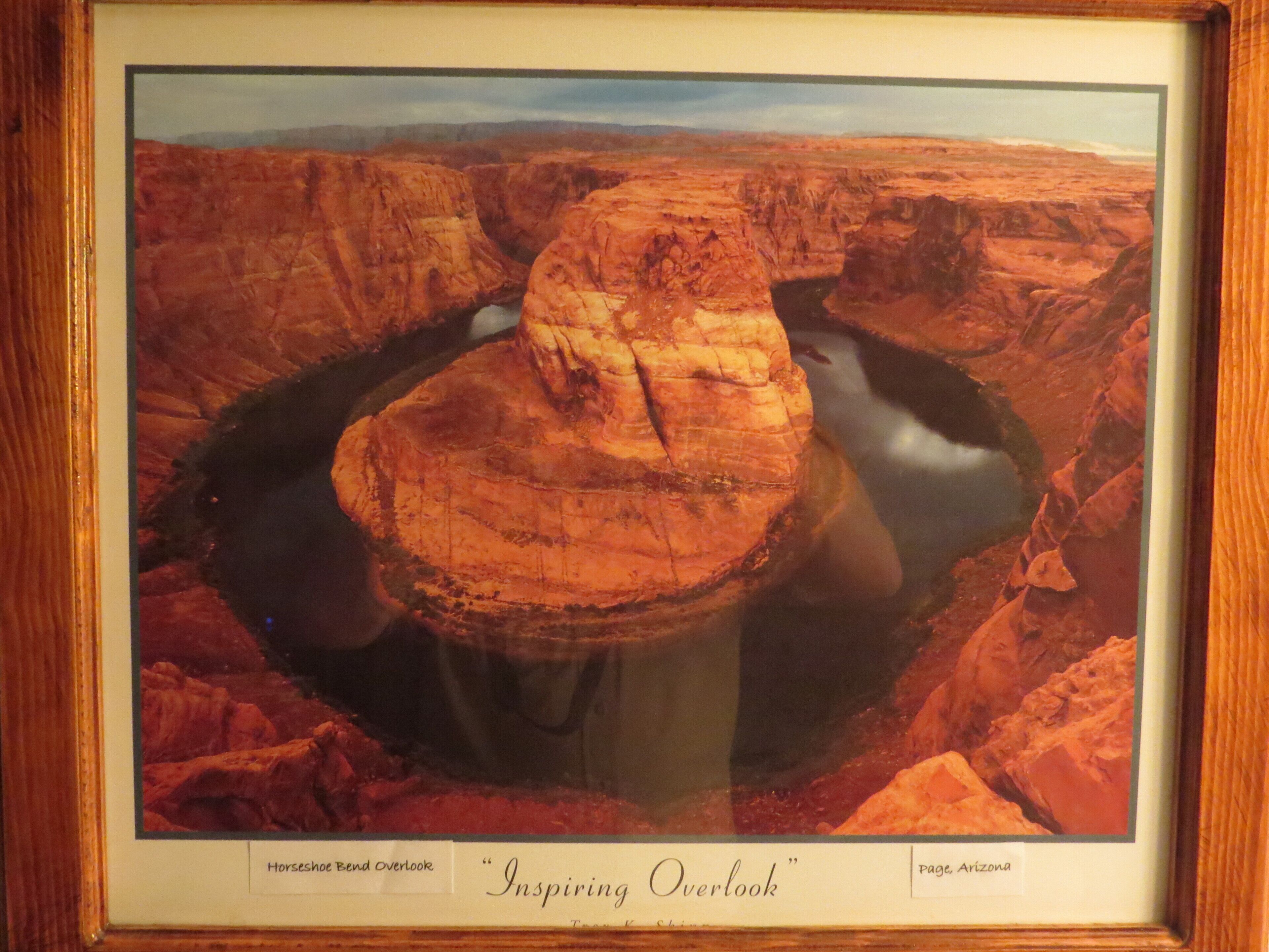 A framed photograph of Horseshoe Bend Overlook with a view of the Colorado River.