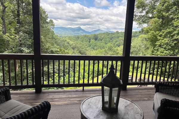 Spectacular view of Chimney Top Mountain from rear covered porch.