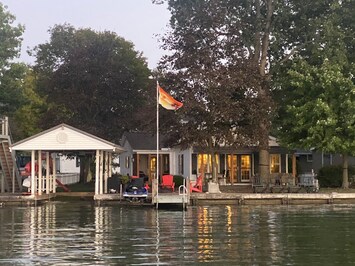 View from lake. There is a space to park a boat along the sea wall.