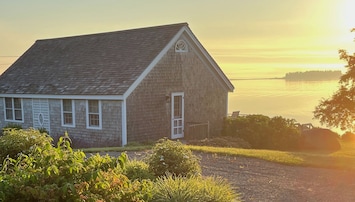 front corner of cottage early in the morning