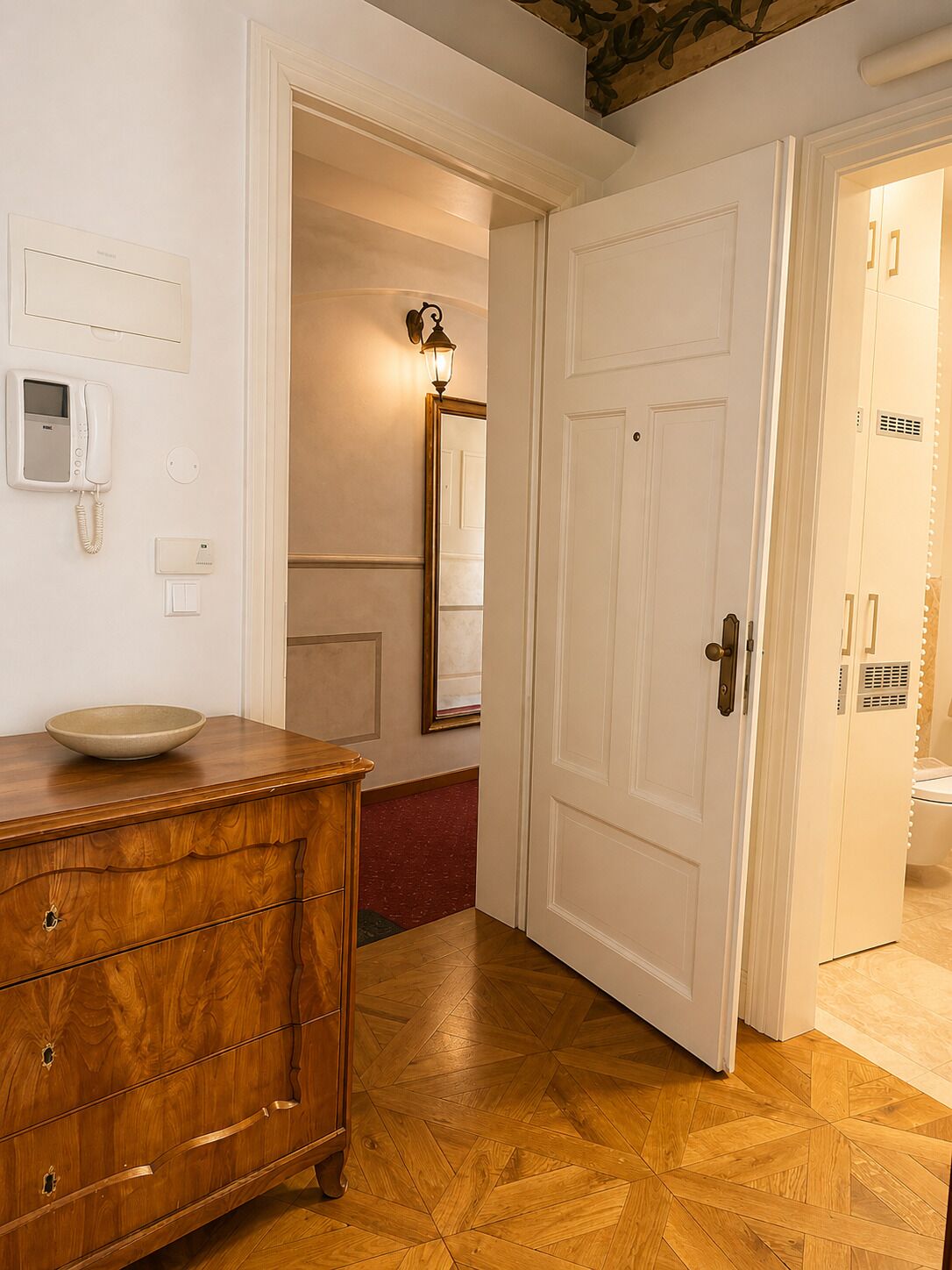 View from private studio entrance, warm wood floors and elegant design.
