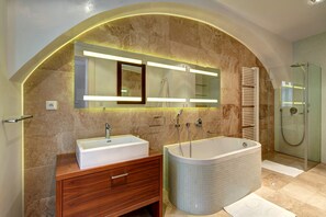 Combined shower/tub, hair dryer, towels, soap