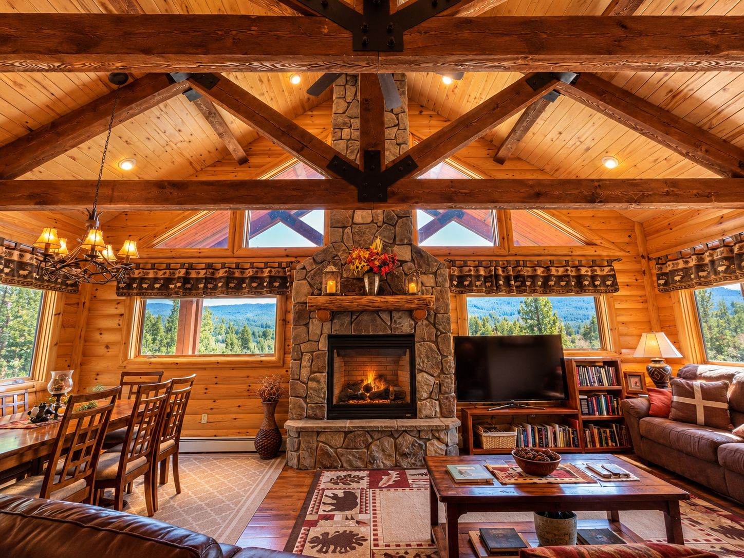 A cozy cabin interior with a stone fireplace, wooden furniture, and a television.