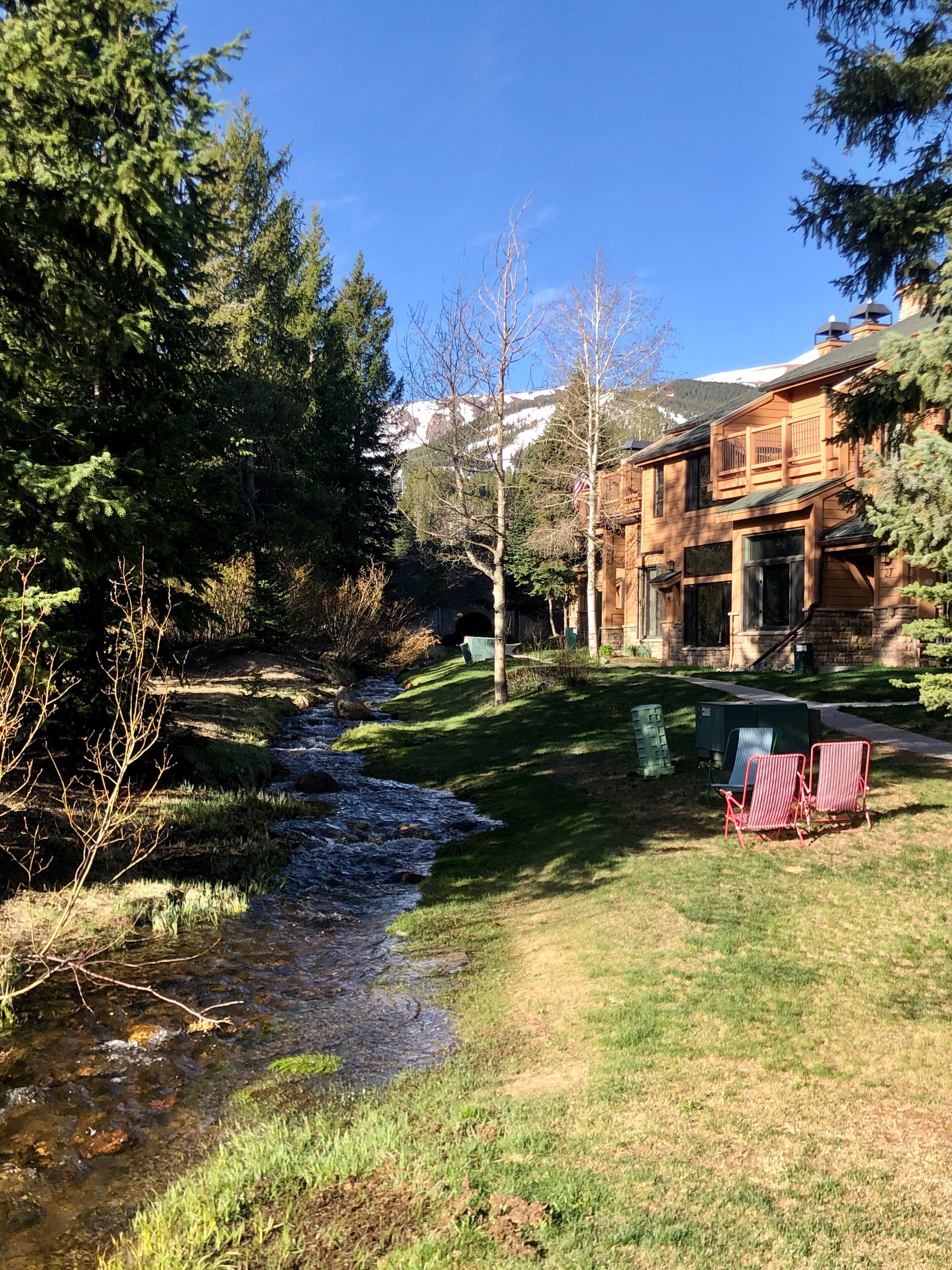 Summer view of the creek outside the front door. Great spot for relaxing.