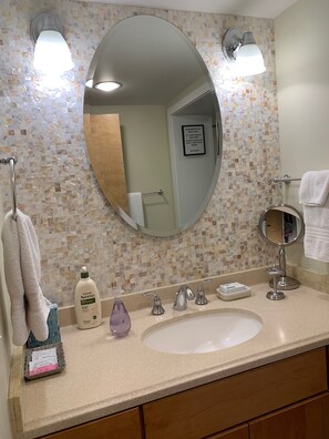 Combined shower/tub, hair dryer, towels, soap