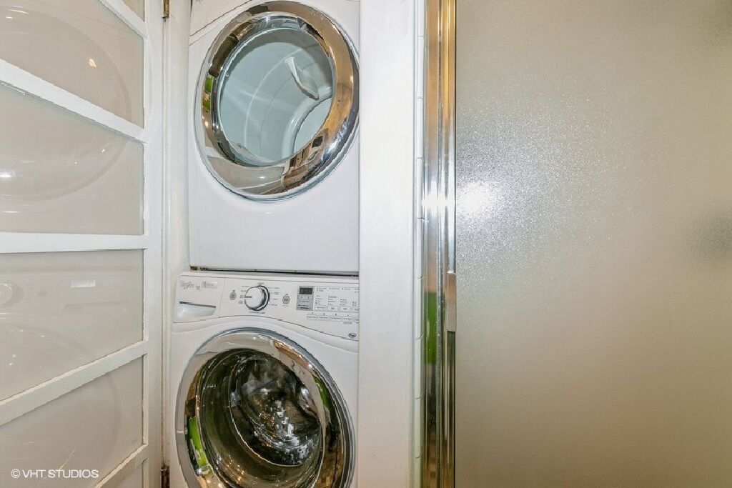 A front view of a stacked washer and dryer unit.