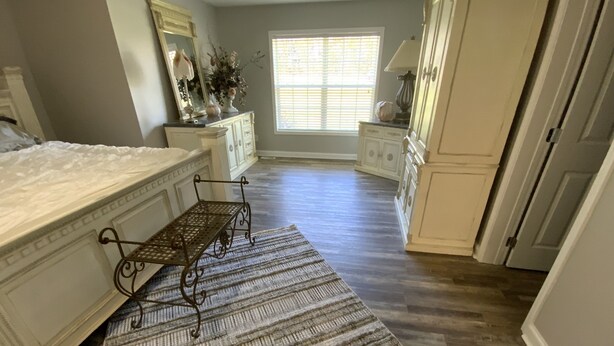 A bathroom with a large mirror, a vanity with a sink, and a window with blinds. - Bargain housing Minutes from Tryon International Equestrian Center (Tryon)