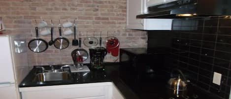 Fridge, microwave, stovetop, coffee/tea maker