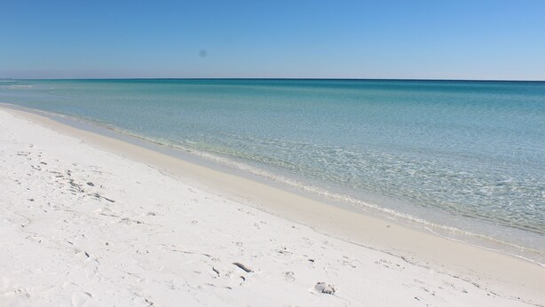 A beach with clear turquoise water and white sand. - BEACH COTTAGE 3BR , GOLF CART W/HOUSE, PORCH SWING ,POOL 30 STEPS AWAY, PETS LOV (Destin)