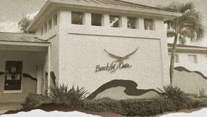 A building with the sign 'Beach Art Center' on the front, featuring a simple facade with a flat roof and a small balcony. - Steps to Beach & Tranquility, #3 Walk to Spectacular Sunsets and Dining (Indian Rocks Beach)