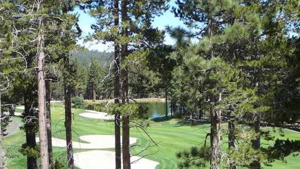A golf course with sand bunkers, surrounded by tall pine trees. - Lovely, 3 Bdr, 2 Ba Walk To Eagle Chair, On Sierra Star Golf Course! (Mammoth Lakes)