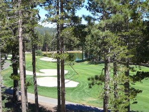 A golf course with sand bunkers, surrounded by tall pine trees. - Lovely, 3 Bdr, 2 Ba Walk To Eagle Chair, On Sierra Star Golf Course! (Mammoth Lakes)
