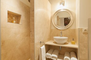 Bathtub, hair dryer, towels, soap