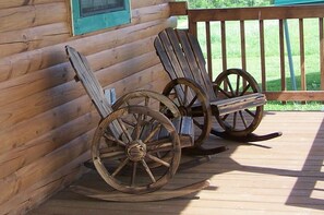 Two rocking chairs on a wooden deck with a wooden cabin wall in the background. - Peace & quiet just 5 minutes from Holly Creek Marina on Dale Hollow Lake! (Celina)