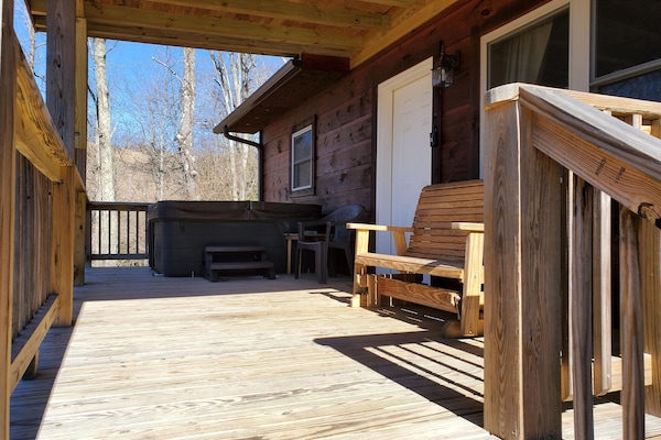 Front porch with hot tub and double slide rocker