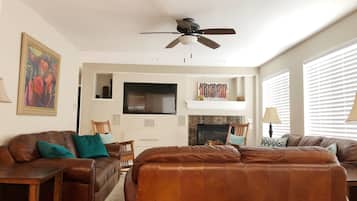 Smart TV, fireplace, table football, books