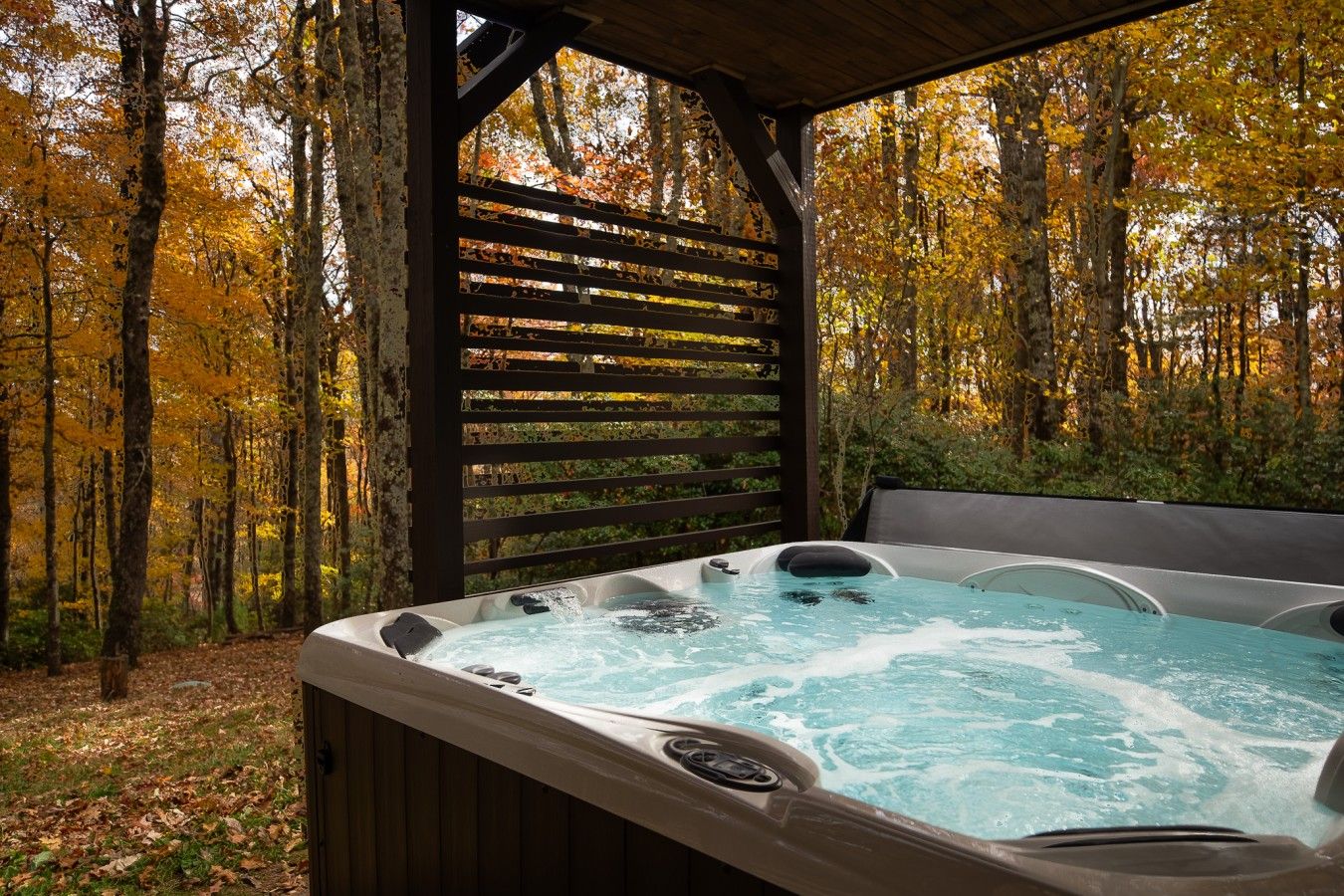 Unwind on the lower level patio in a hot tub that seats up to 7.