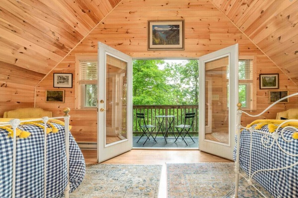 Cafe table and chairs provided to enjoy the views from the balcony in the upstairs bedroom.