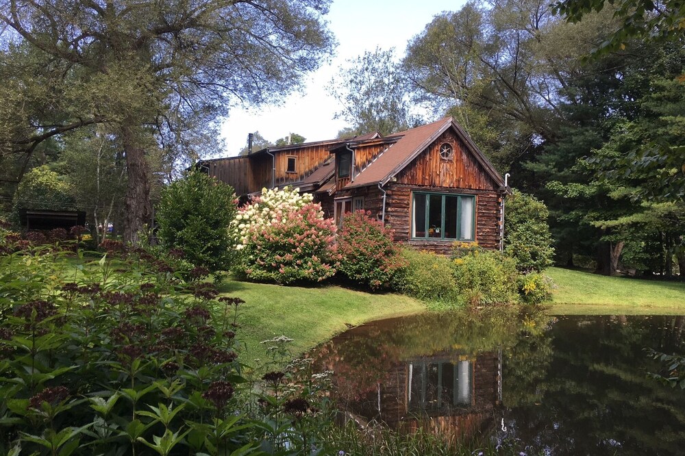 Stunning, Secluded Log Home Surrounded by Woods and Water