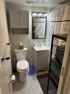 Combined shower/bathtub, hair dryer, towels, soap