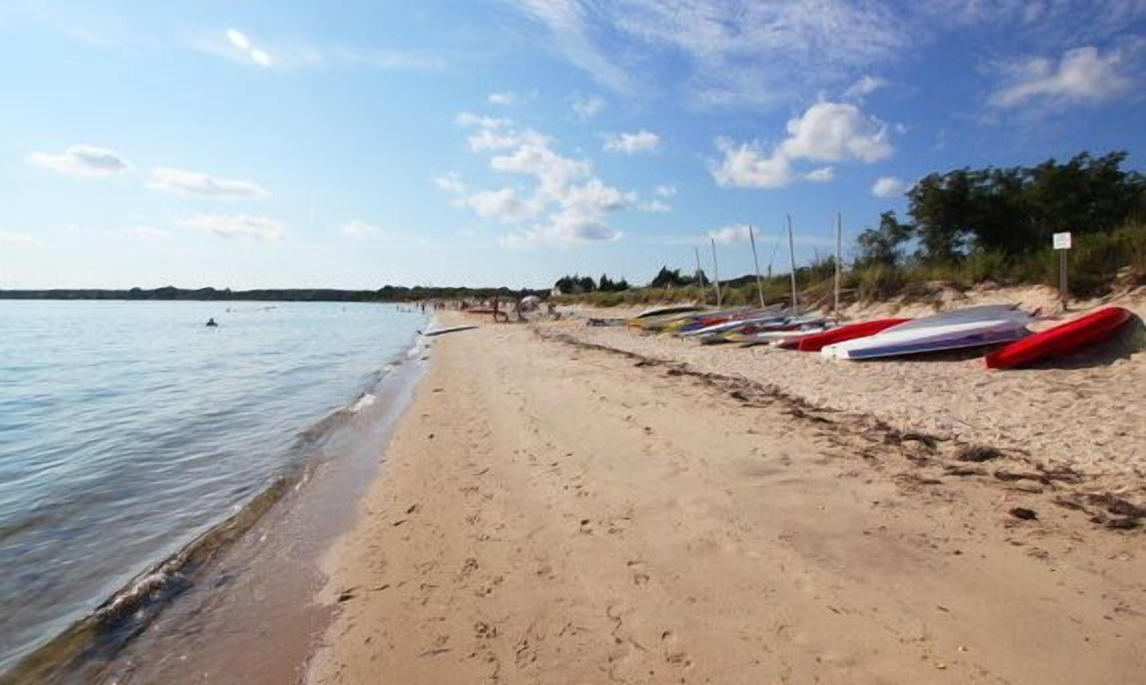 Directly on best Beach. Modern home with water & sunset views!