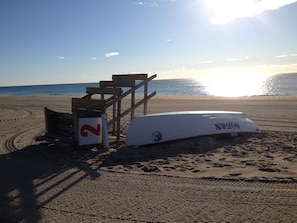 Enjoy a day at the beach with a lifeguard station nearby, offering a safe and convenient spot to relax.