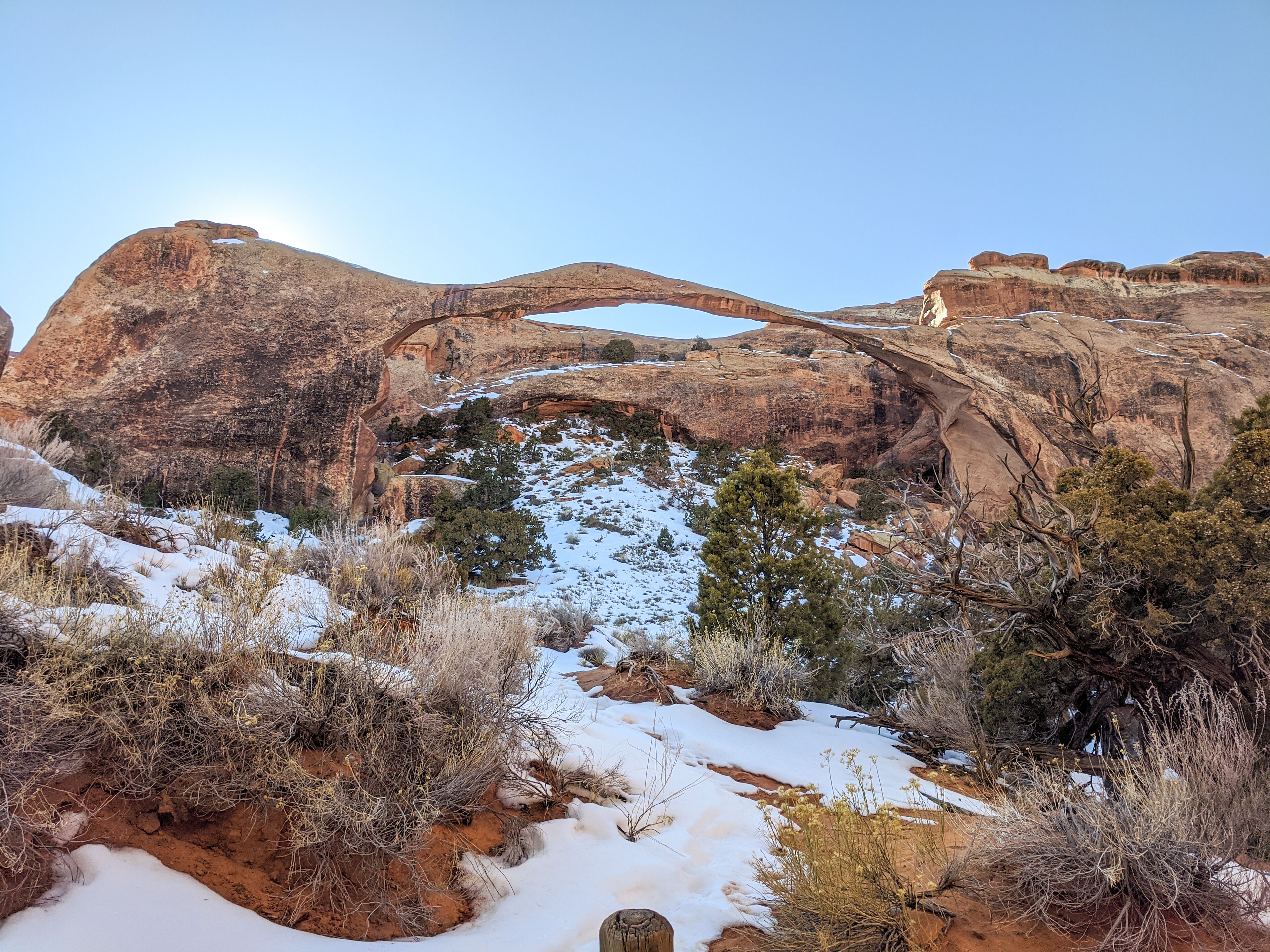 A natural rock formation with a bridge-like structure.