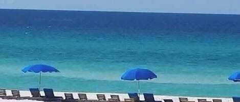 On the beach, sun-loungers