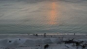 On the beach, sun loungers, beach towels
