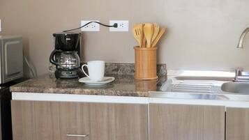 Fridge, microwave, stovetop, coffee/tea maker