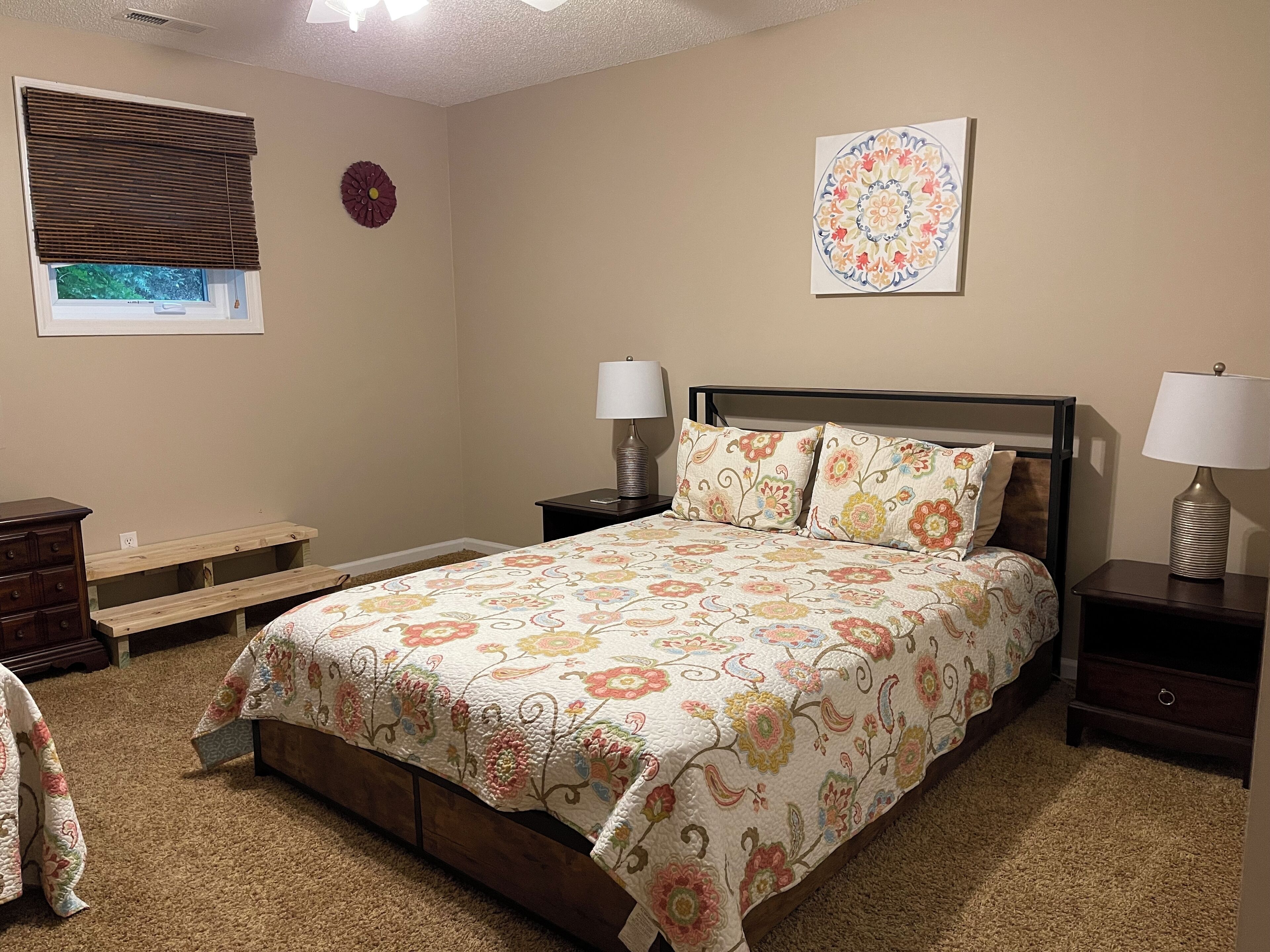 Downstairs bedroom with twin and queen bed. 