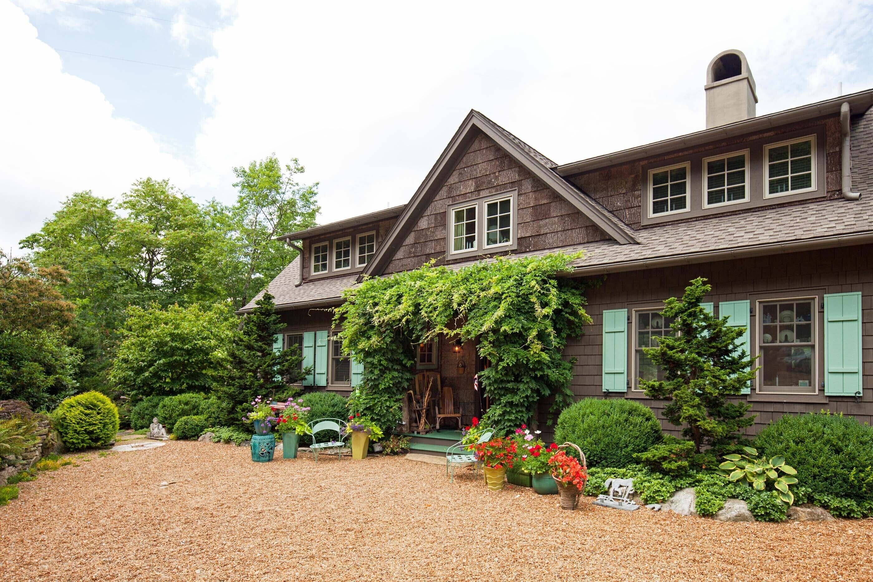 Gardens surround Tucked Inn with Big Creek below | No Pet Fee, We love pets!