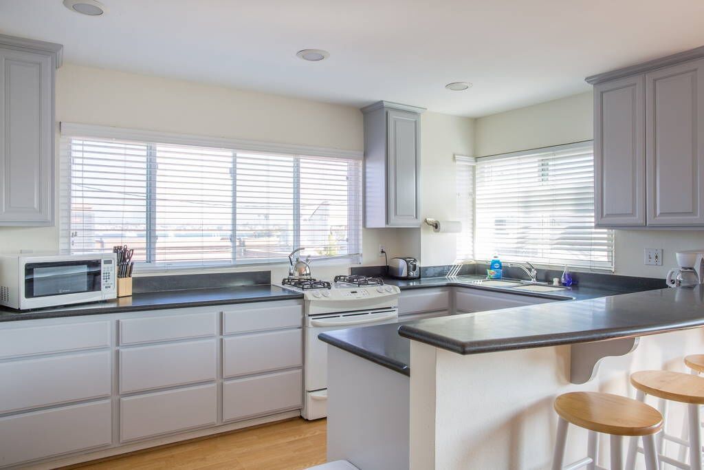 LOCATION AND VALUE! 3 Bed, 2 Bath, 2 Parking Spots, Top Level with Water Views