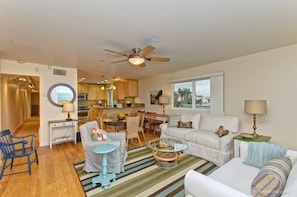 Relax in this inviting living space with a dining area, seating area, and fully equipped kitchen.