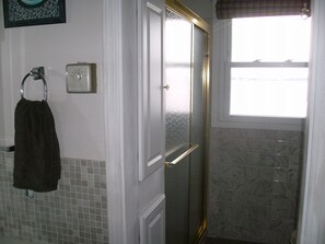 Shower, hair dryer, towels, toilet paper